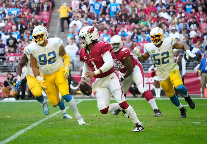 Nov 27, 2022; Glendale, AZ, USA; Arizona Cardinals quarterback Kyler Murray (1) scrambles away from Los Angeles Chargers defensive end Joe Gaziano (92) and linebacker Khalil Mack (52) during the second quarter at State Farm Stadium.